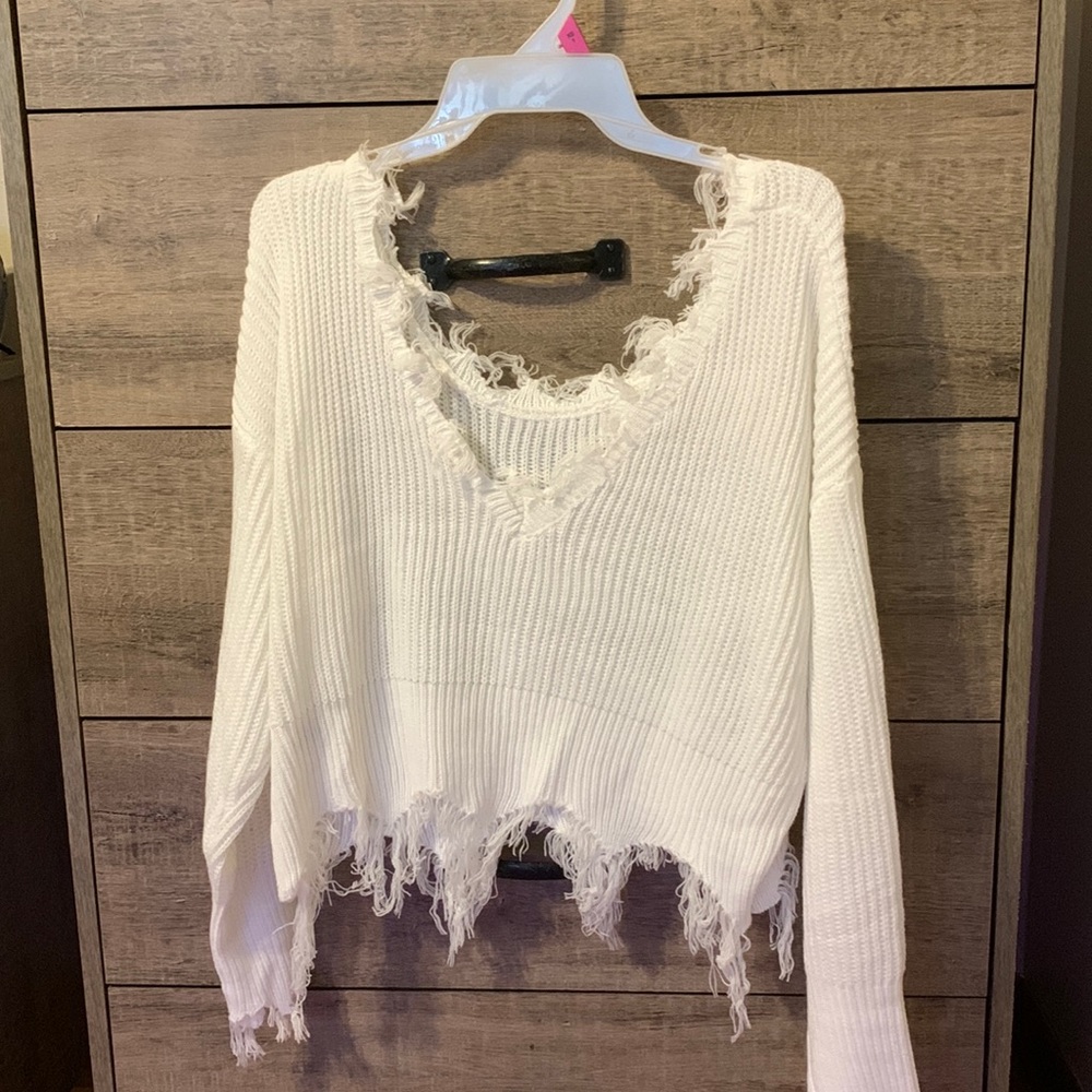 Distressed off the shoulder sweater